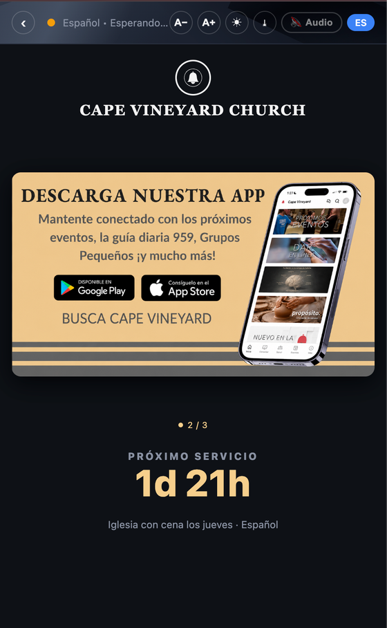 A church guest's phone showing a translated announcement in Spanish during the service