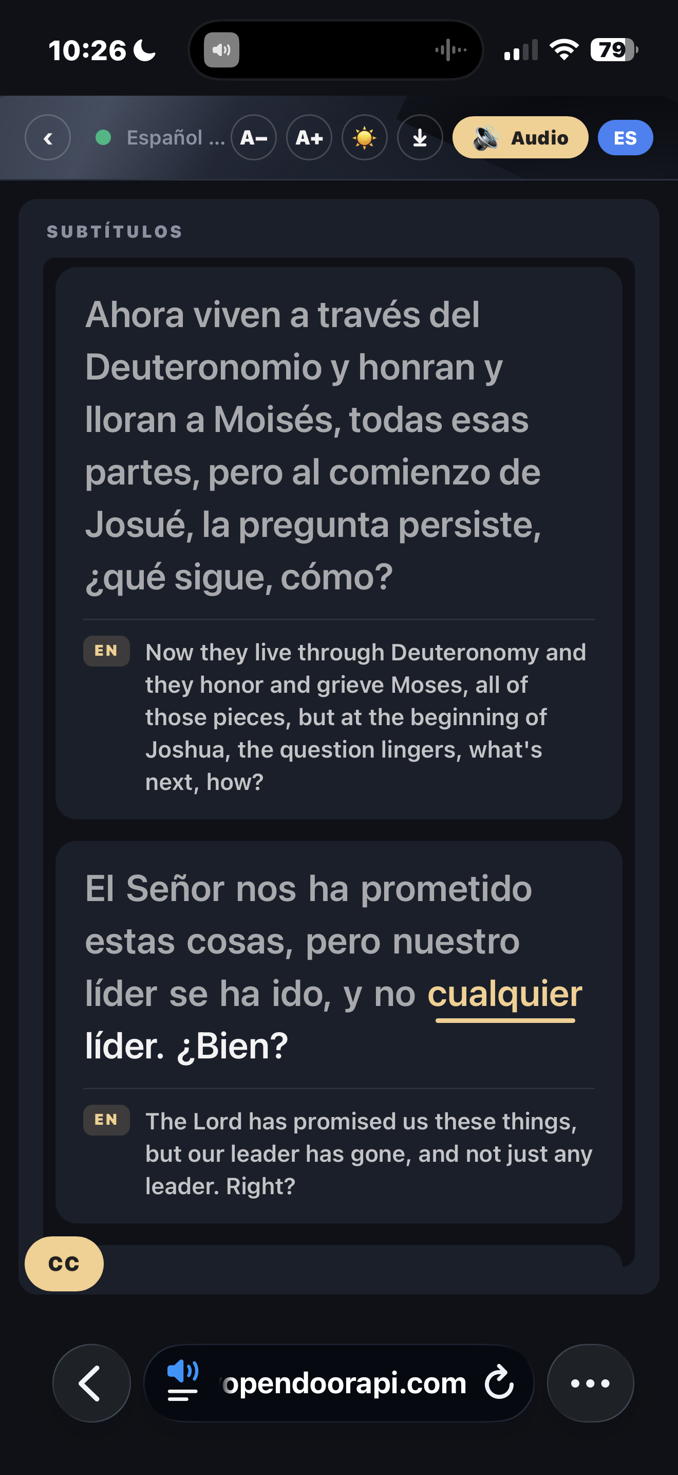 A church service captioned in Spanish with the English source shown beneath each line, on a guest's phone